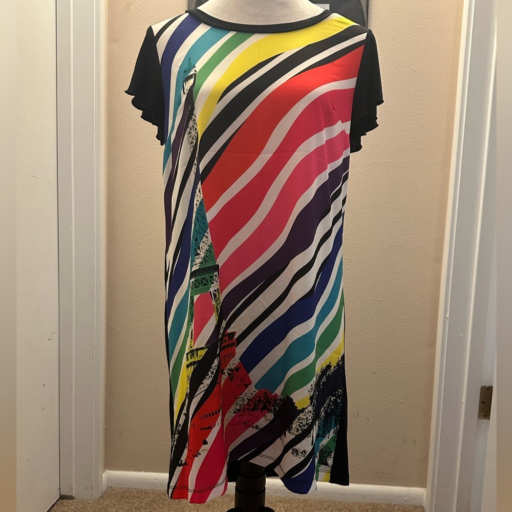 Junior Gaultier Black Garment with White Label and Red Accents